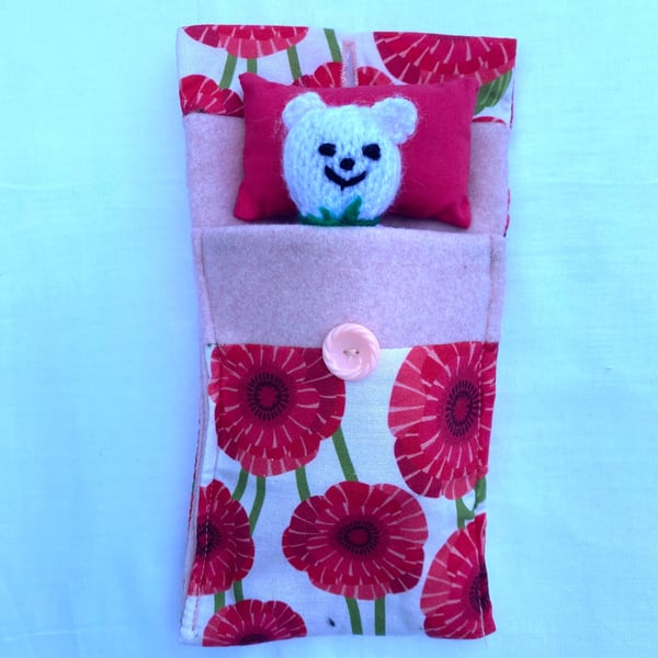 Cute hand knitted mini bear in a purse