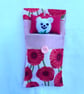 Cute hand knitted mini bear in a purse