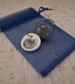 Pebble keyring with an ammonite fossil image - Image 1