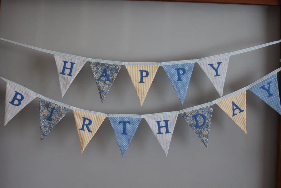 'Happy Birthday' bunting in shades of blue and yellow