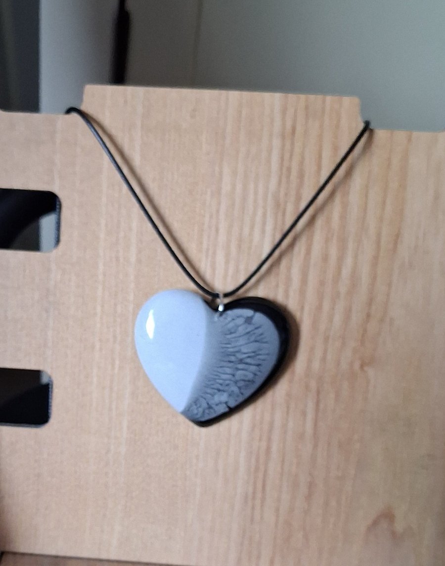 Handmade resin heart pendant on  black waxed cord