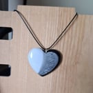 Handmade resin heart pendant on  black waxed cord