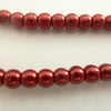 100 red glass pearls