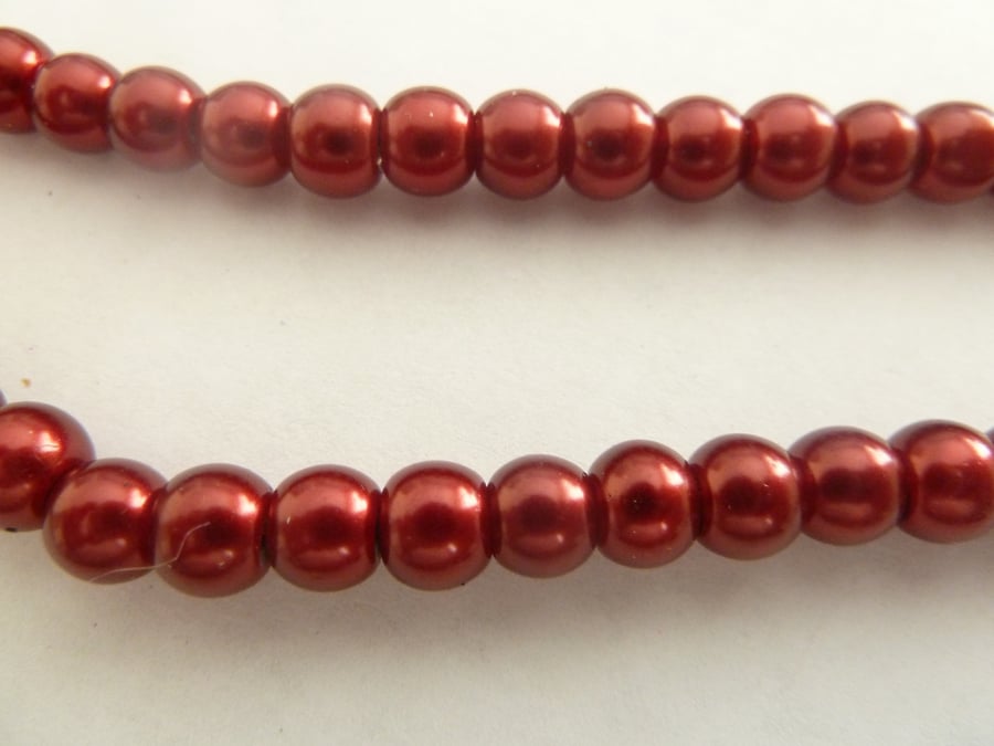 100 red glass pearls