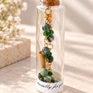 Tree Agate and Emerald Crystal Bracelet in a message bottle.