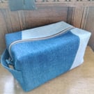 A large box shaped toiletry bag