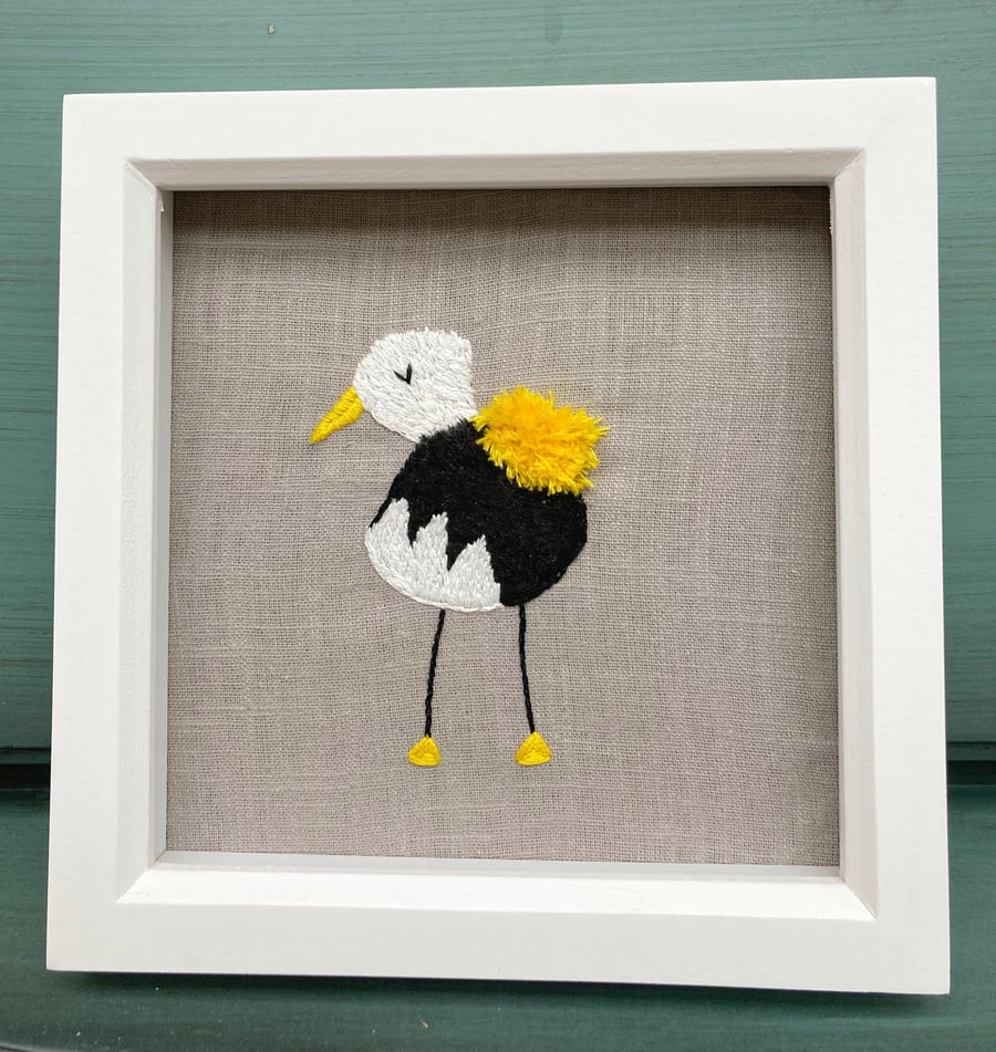 Cute, funky yellow bird embroidered picture.