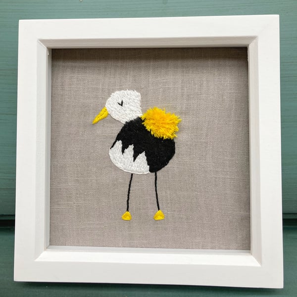 Cute, funky yellow bird embroidered picture.