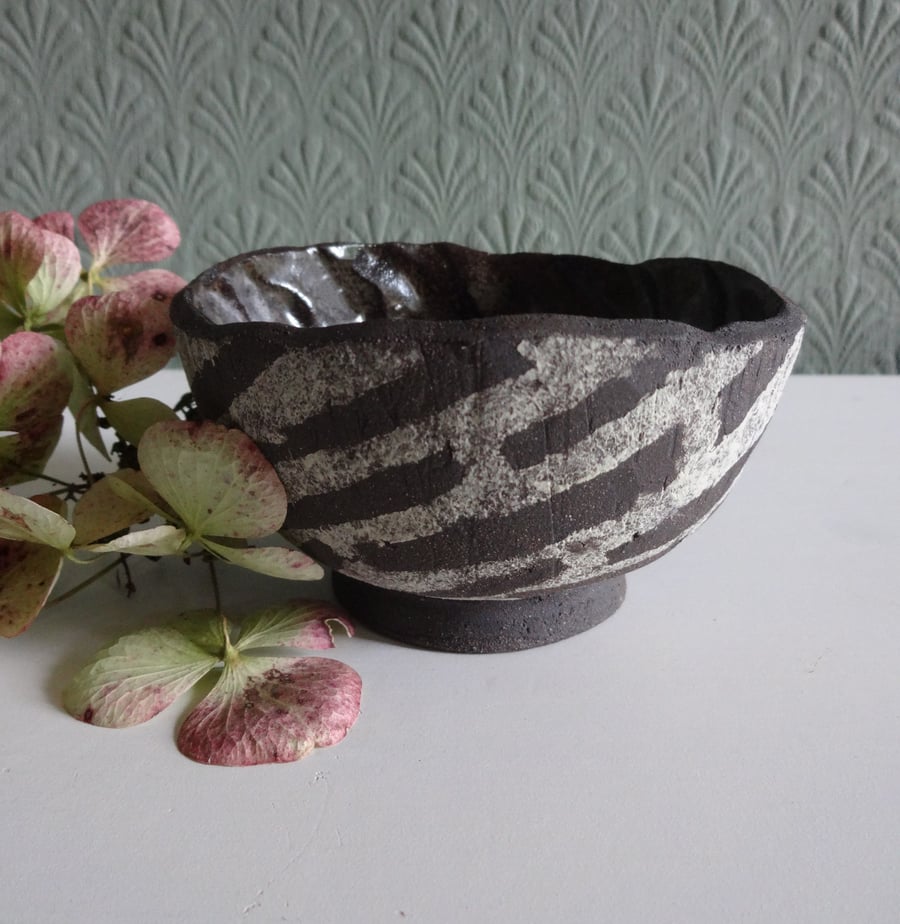 Small bowl, handmade black ceramic, swirl textured satin glaze inside.