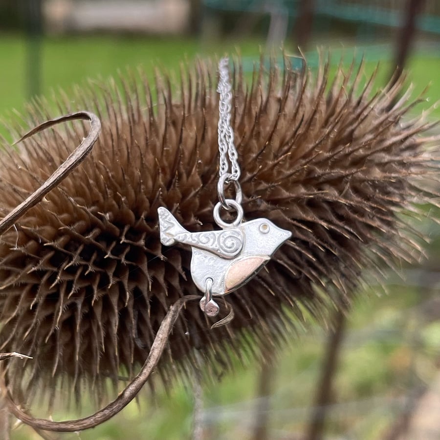 Silver and rose gold Robin pendant and chain.