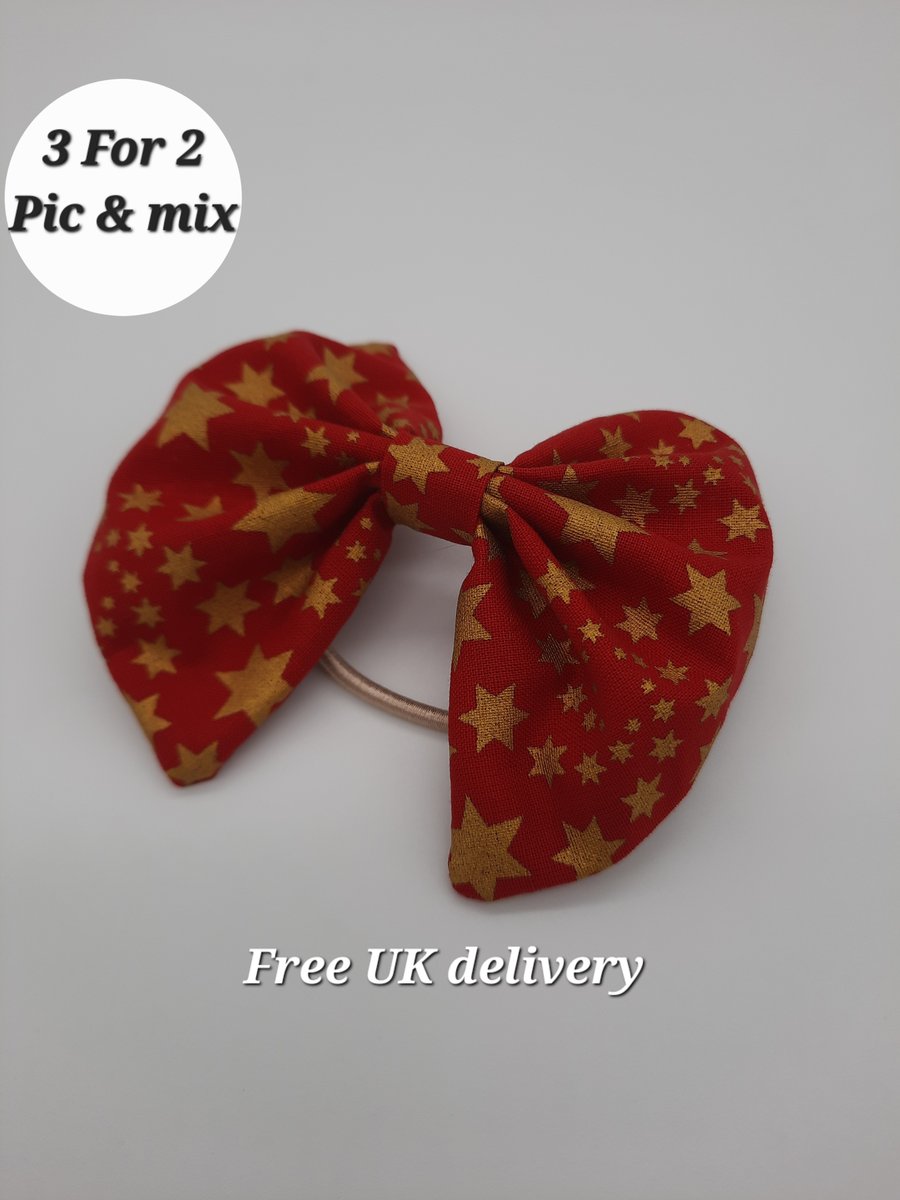 Hair bow bobble red with gold stars. 