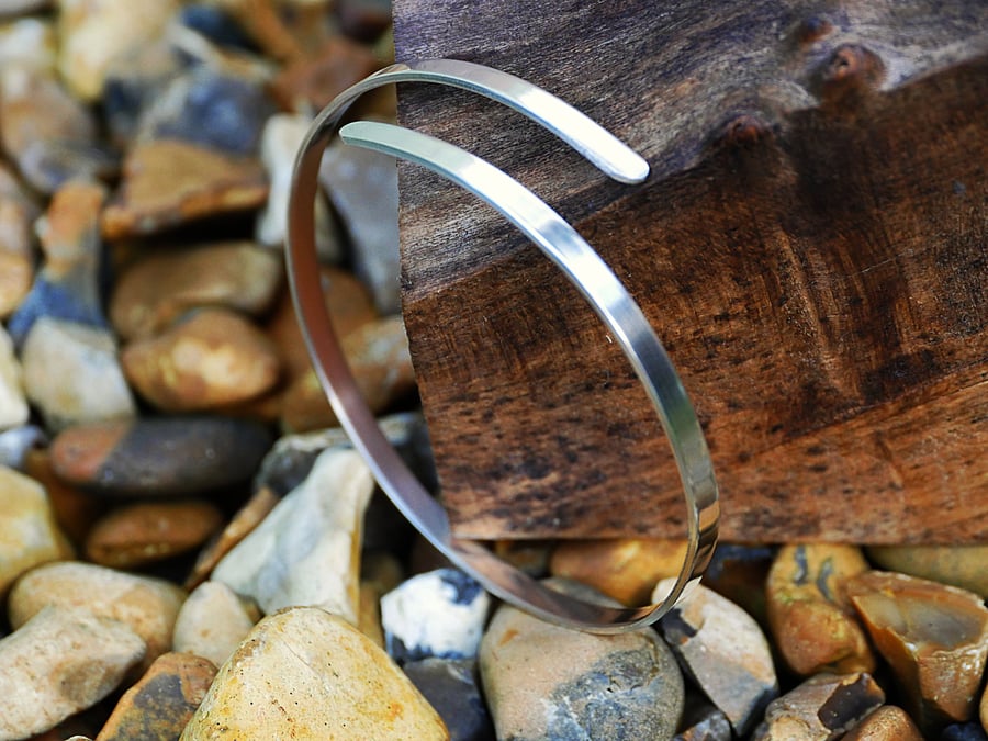 Slightly adjustable Flat silver bangle
