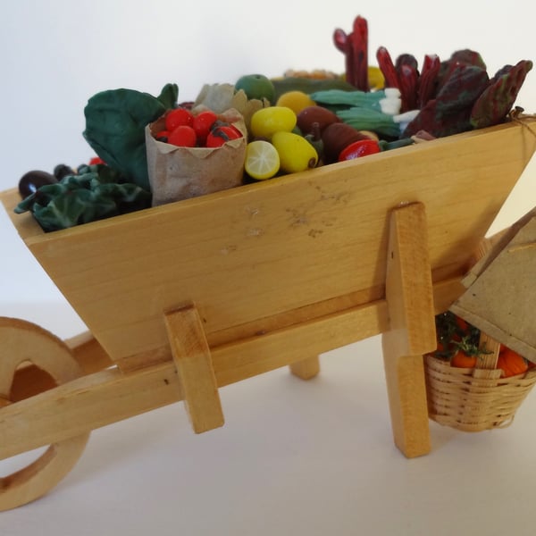 Wheelbarrow with vegetables and flowers