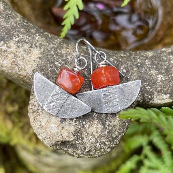 Silver and orange carnelian tribal blade earrings.