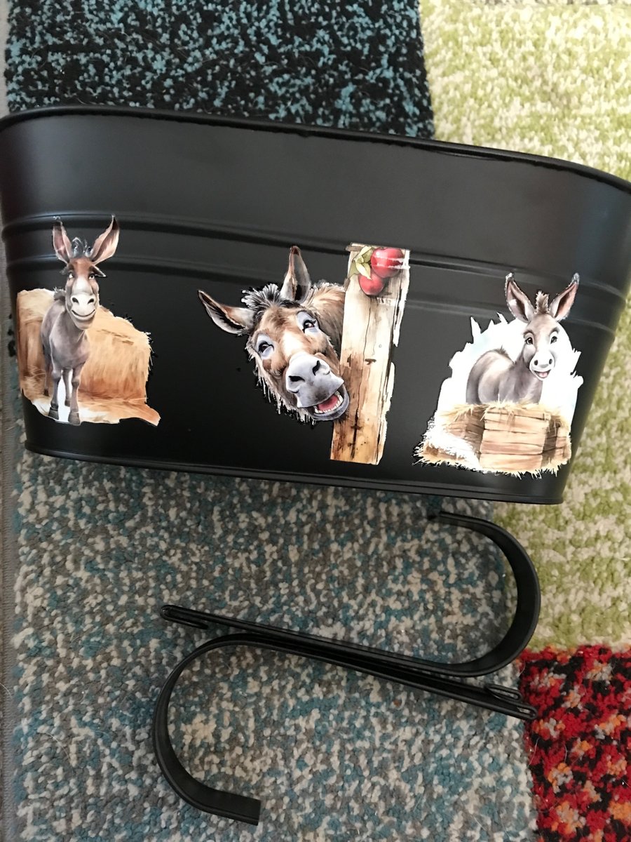 Black fence planter with cheeky donkey motif