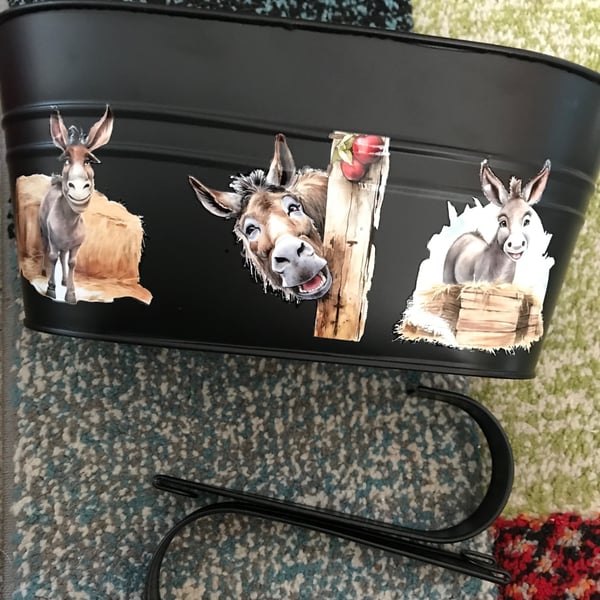 Black fence planter with cheeky donkey motif