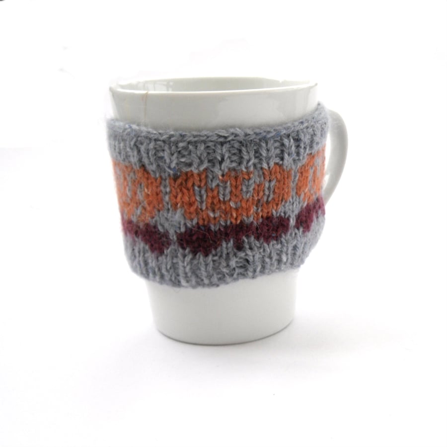 Butterfly mug cosy hand knit in Rowan tweed wool 
