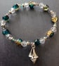 Elasticated bracelet with blue and clear beads and silver shell charm  - Image 5