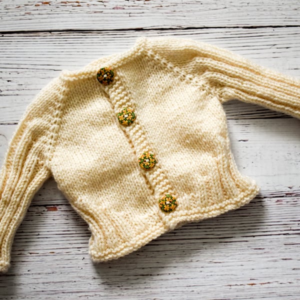 Hand Knitted cardigan in cream with floral buttons - newborn