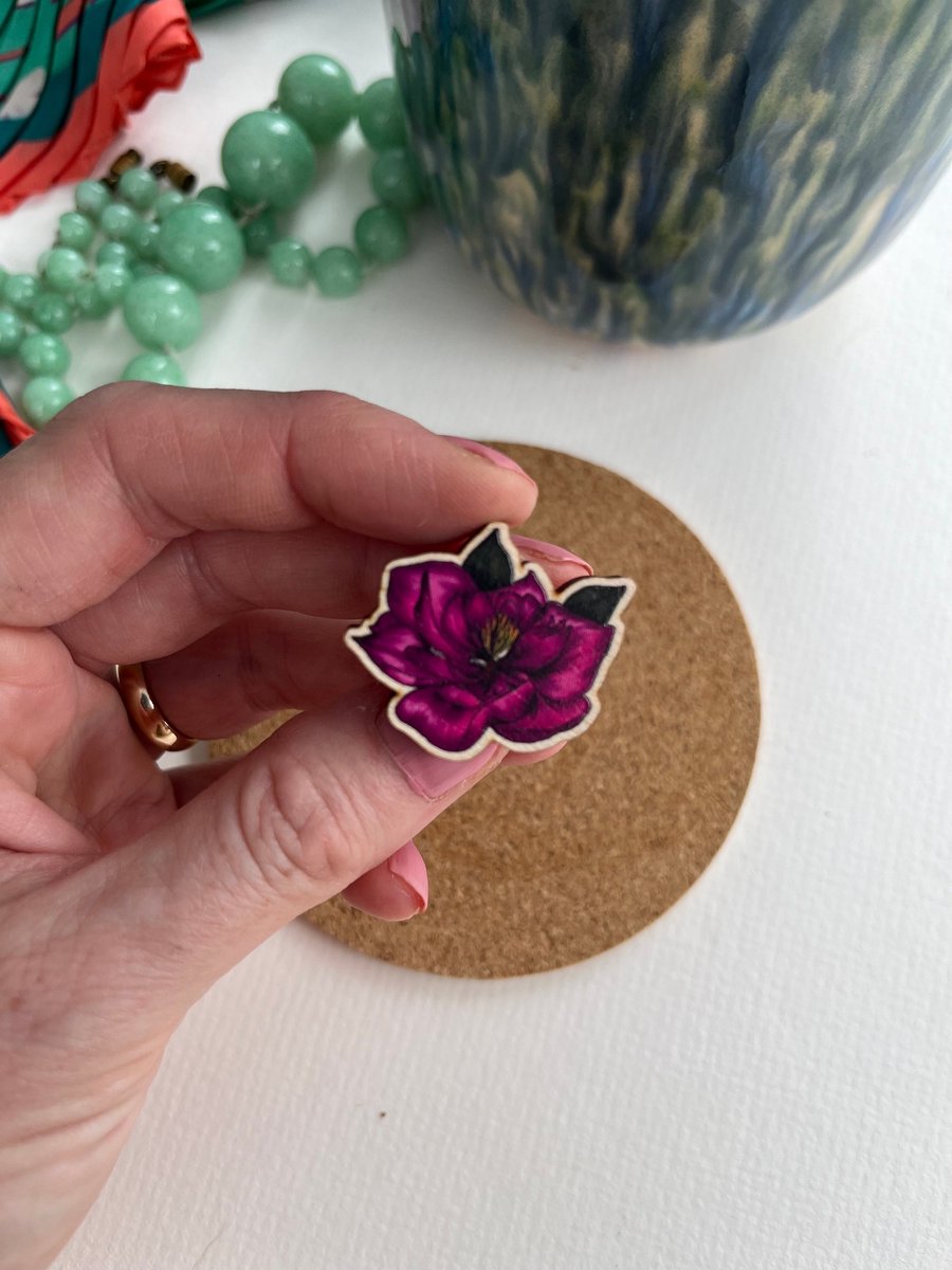 magenta magnolia pin badge, maple wood brooch with silver badge back. Pin badges