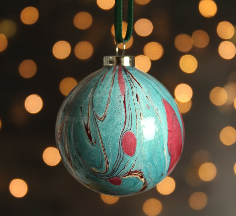 Marbled ceramic Christmas bauble in metallic teal and metallic red