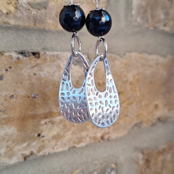 Wrought metal earrings with black ceramic beads