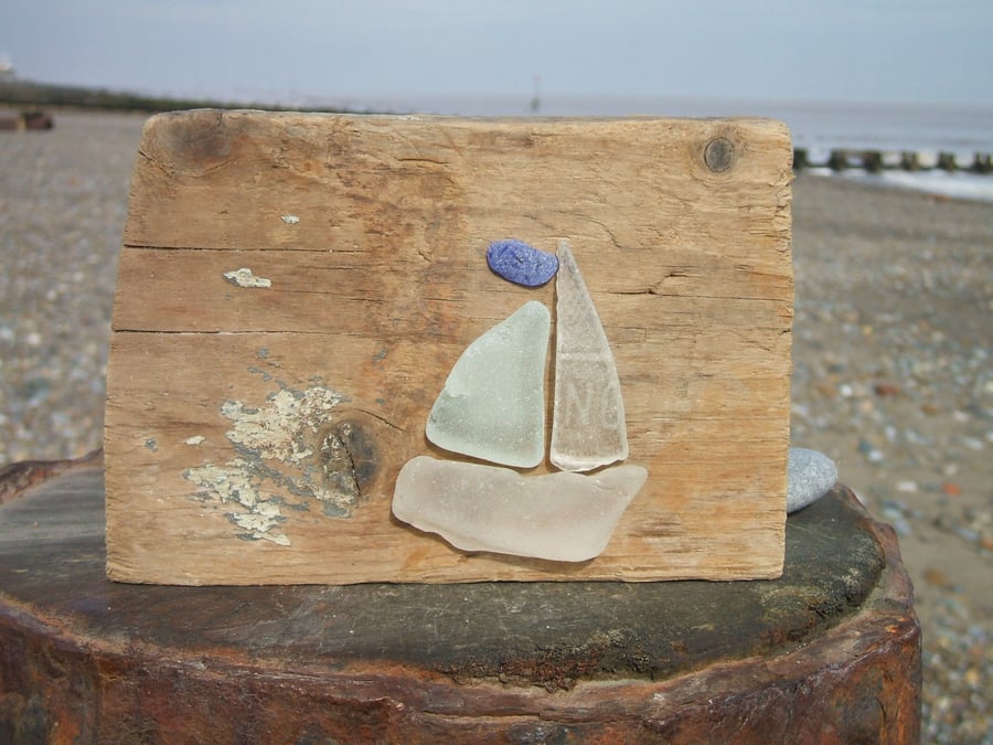 Seaglass and driftwood decoration - boat with a blue pennant