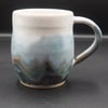 Large stoneware pottery mug finished multi-coloured blue layered & white glaze.