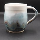 Large stoneware pottery mug finished multi-coloured blue layered & white glaze.