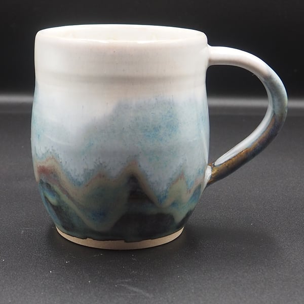 Large stoneware pottery mug finished multi-coloured blue layered & white glaze.