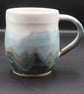 Large stoneware pottery mug finished multi-coloured blue layered & white glaze.