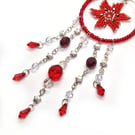 Red and silver poinsettia star beaded hanging decoration