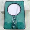 Enamelled photo frame in copper with molten glass flowers - Green