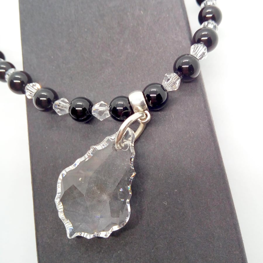Small Clear Crystal Baroque Style Pendant on a Black and Clear Beaded Necklace