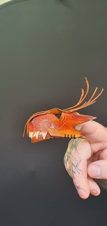 Dragon finger puppet.