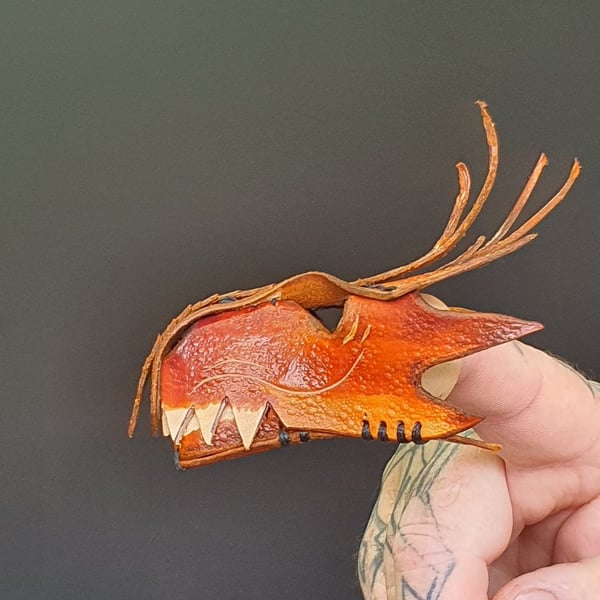 Dragon finger puppet.