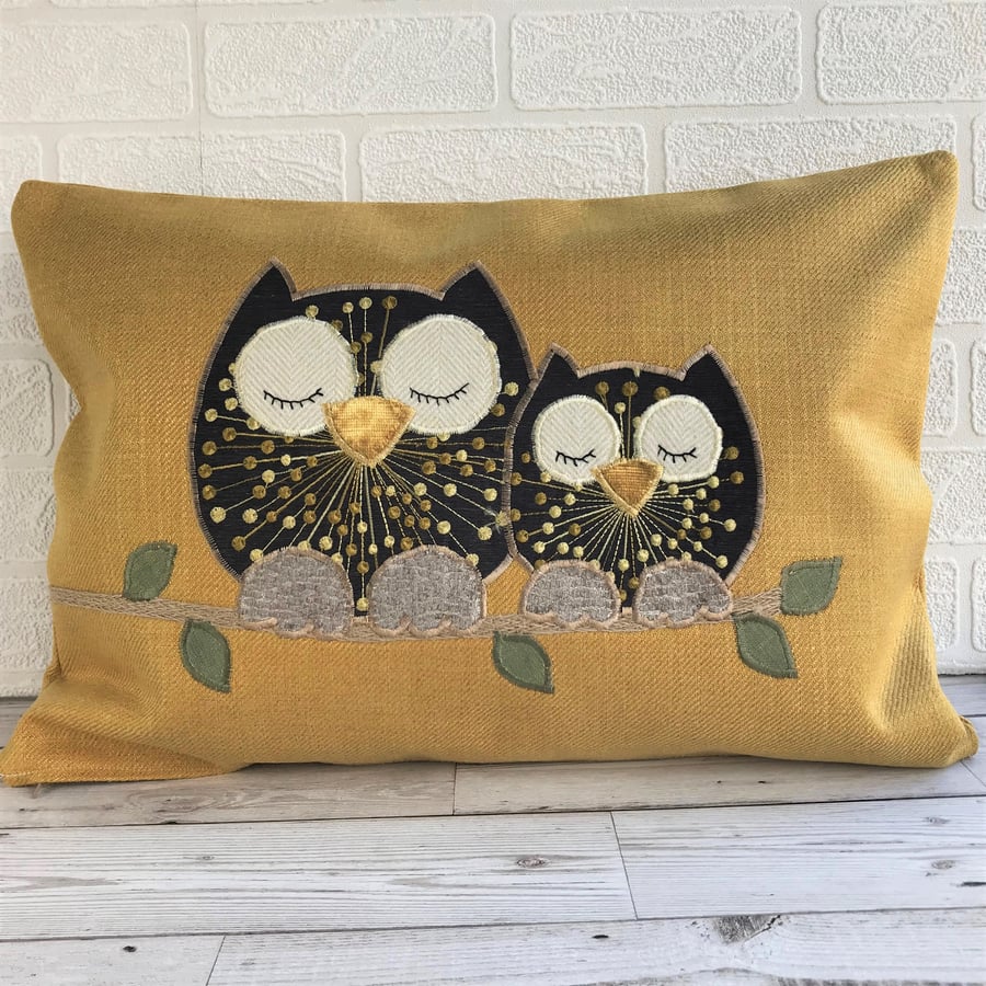Sleepy owls cushion with brown owls on a mustard cushion