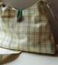 Crossbody pyramid shoulder bag in green and mauve checks - Image 1