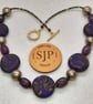 Purple, gold and black polymer clay disc shaped necklace  - Image 4