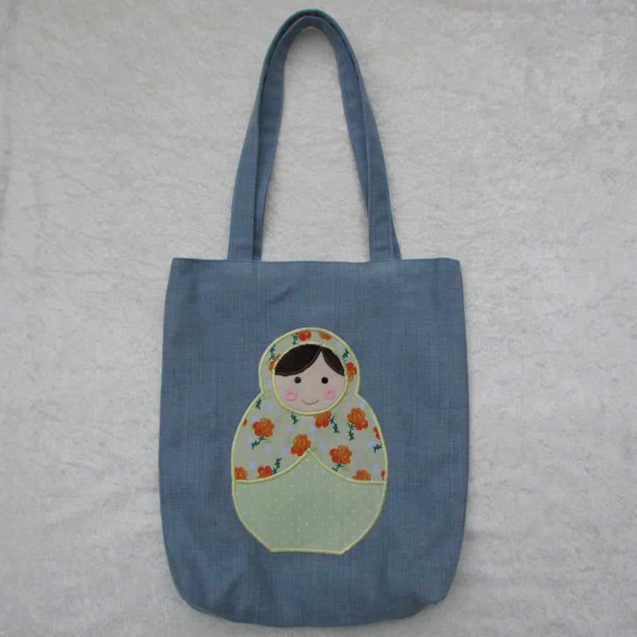 Russian Doll appliqued tote bag in blue and yellow