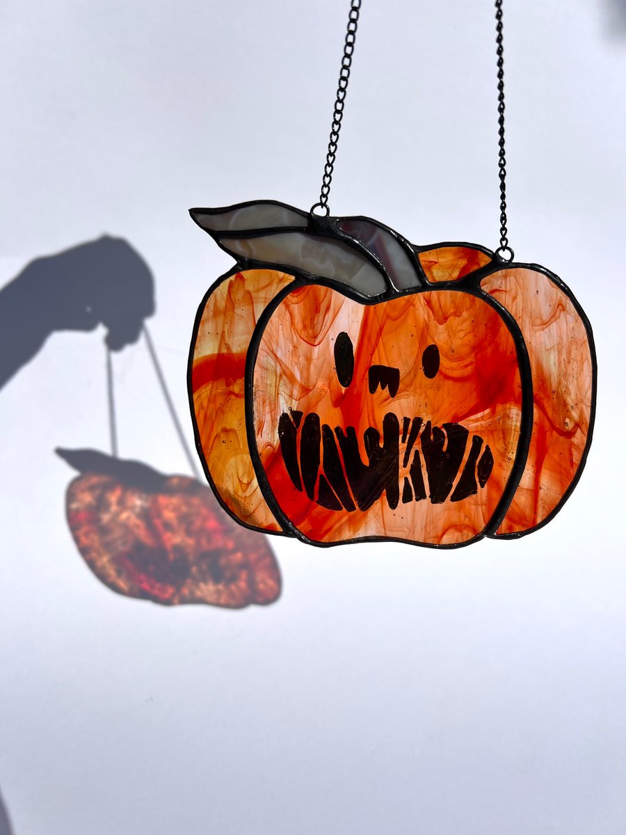 Iridescent orange stained glass pumpkin suncatcher with draw your own kit