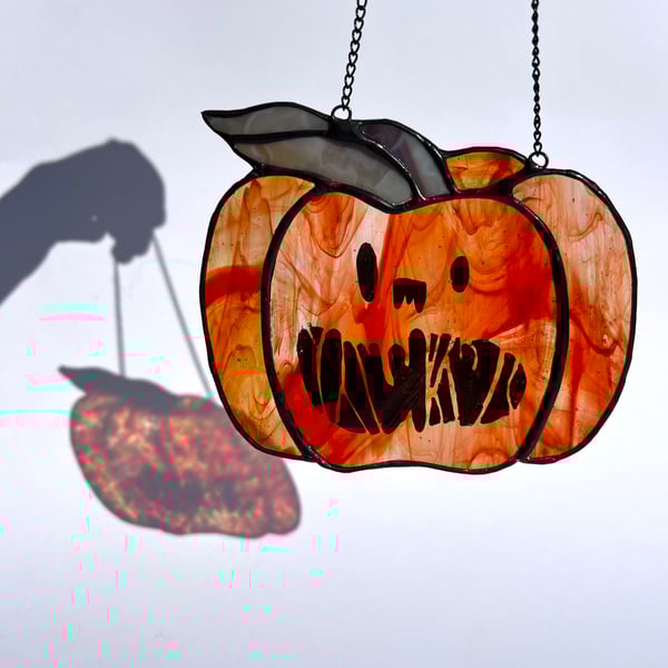 Iridescent orange stained glass pumpkin suncatcher with draw your own kit