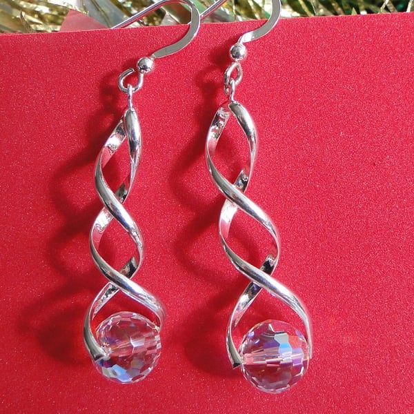 Sparkling Chrystal globe earrings on a twisted silver fitting