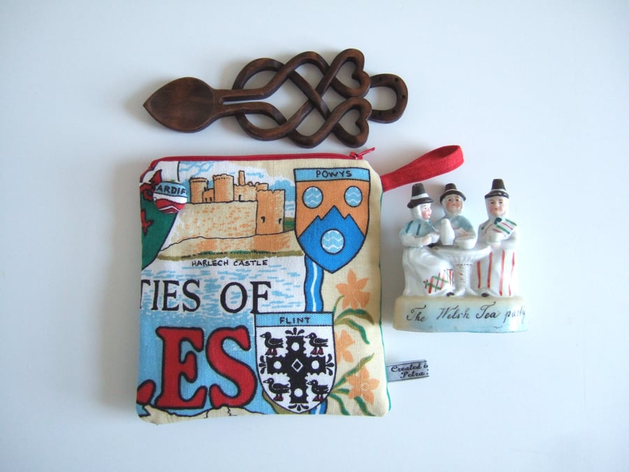 Purse, cosmetics or makeup bag with vintage Welsh map and seaside illustrations.