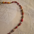 Orange paper and glass beaded necklace