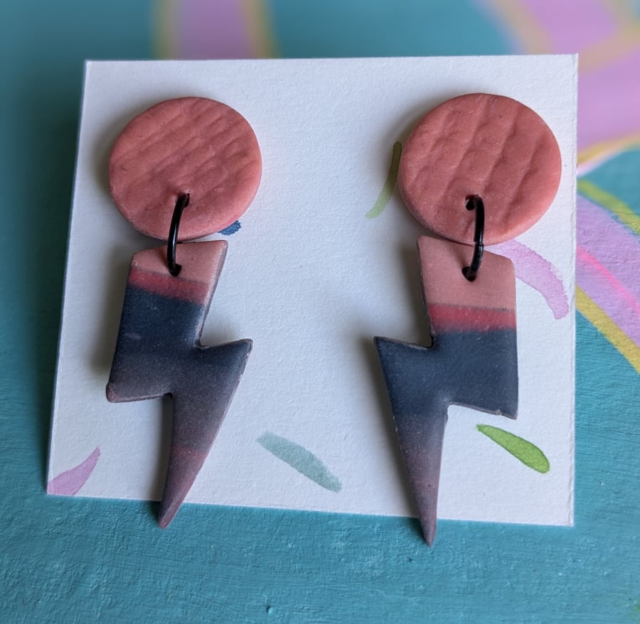 Pink and blue lightening bolt dangly earrings