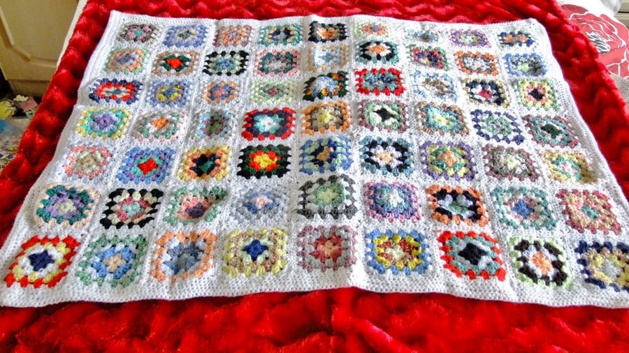 White crochet baby or dolls blanket 40" x 32". For cot, pram or push chair.