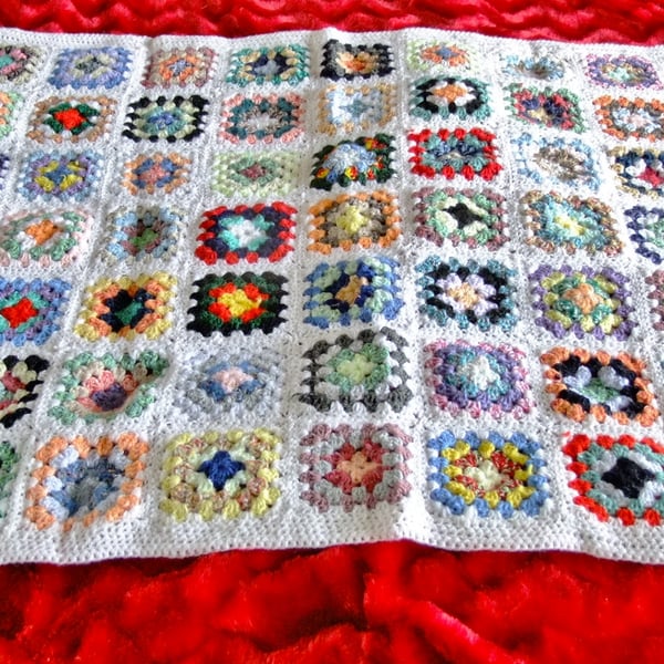 White crochet baby or dolls blanket 40" x 32". For cot, pram or push chair.