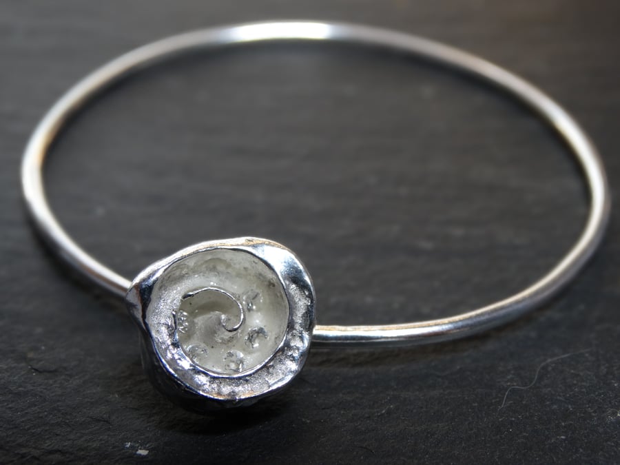 Sterling silver bangle with cast shell charm with cubic zirconiass