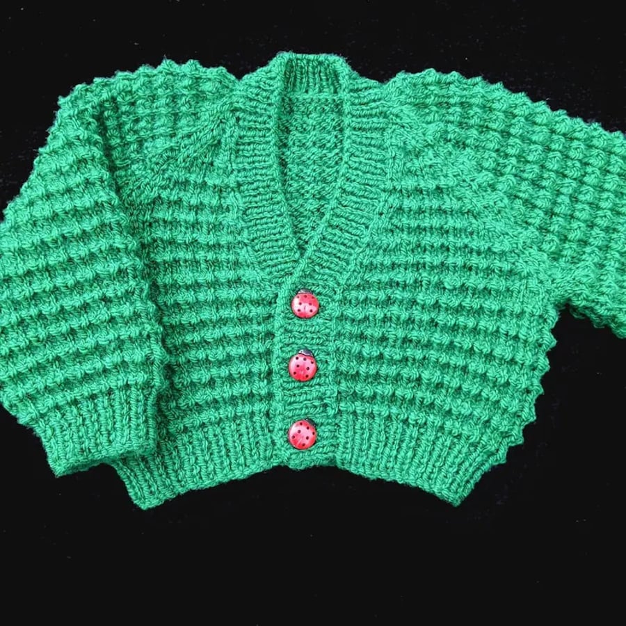 Hand knitted baby cardigan in emerald green with textured pattern Seconds Sunday
